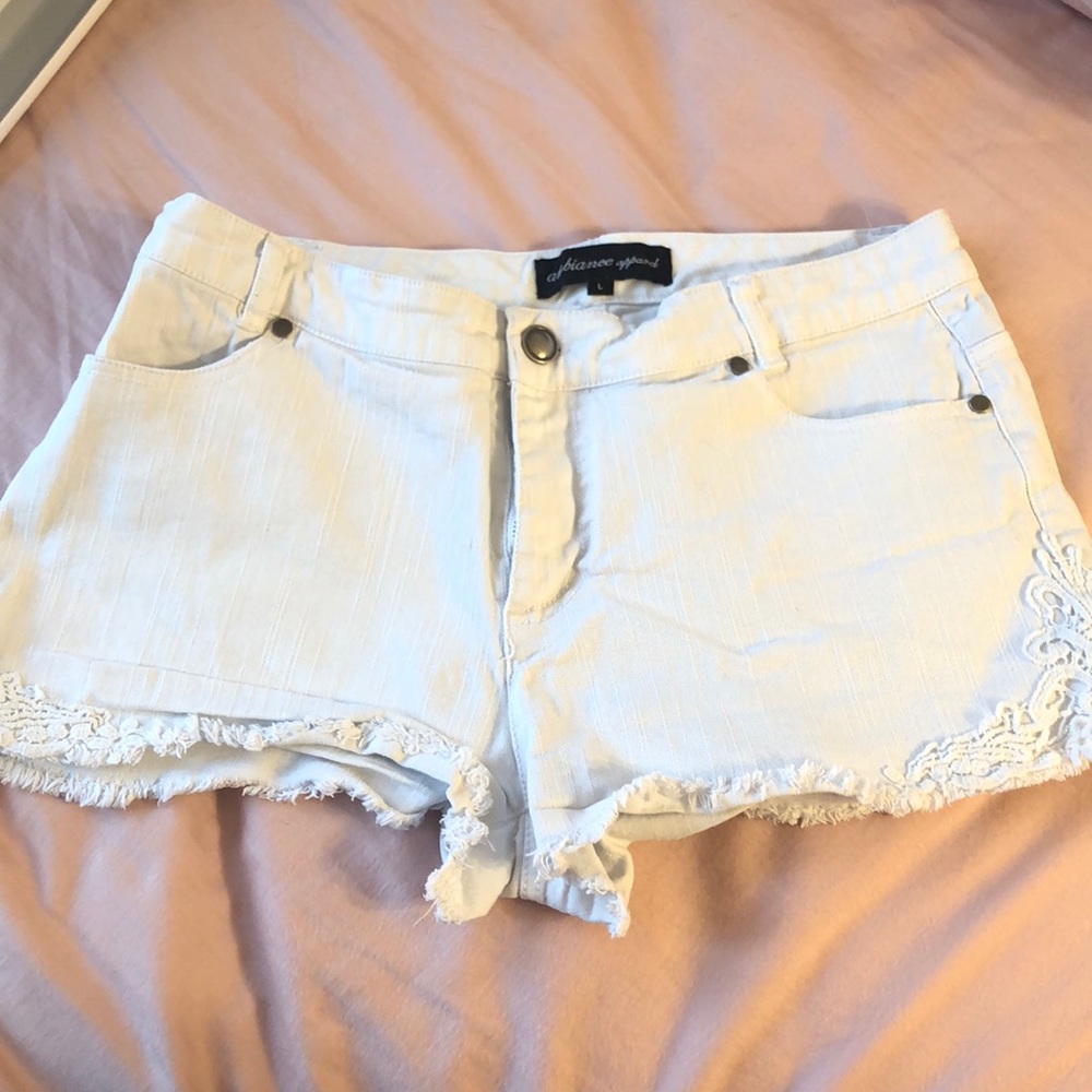 White jean shorts with lace accent